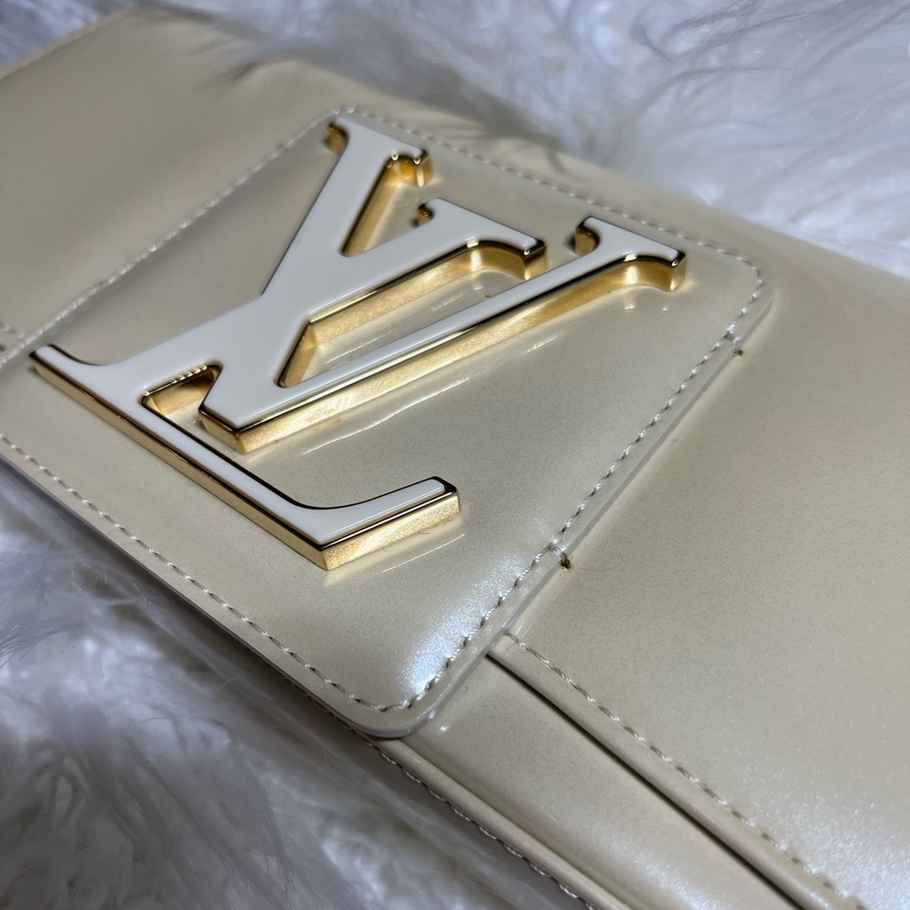 Authentic Louis Vuitton Sobe clutch.